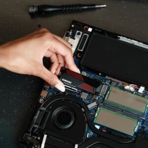 A person is working on a laptop computer