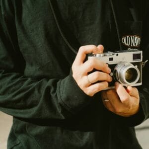A man holding a camera in his hands