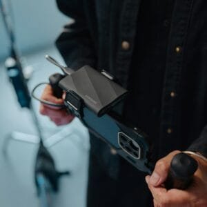 A man holding a cell phone in his hand