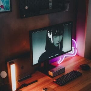 A desktop computer sitting on top of a wooden desk