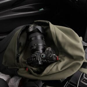 A camera bag sitting on the seat of a car